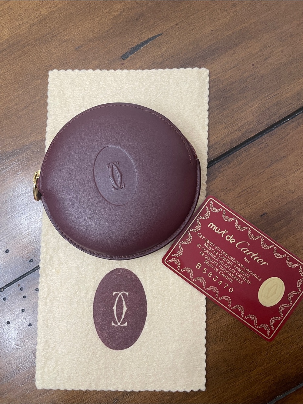 Authentic & VintageCartier Round Leather Coin Case in Burgundy Gold Hardware